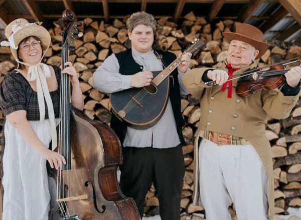 photo of three musicians in pioneer garb